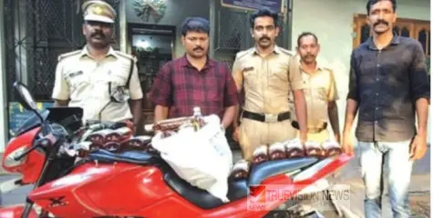 ഇരിട്ടിയിൽ ബൈക്കിൽ  മദ്യവിൽപ്പന ; യുവാവ് എക്സൈസിൻ്റെ പിടിയിൽ